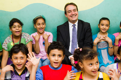 UN Women Deputy Executive Director Yannick Glemarec poses with children trained by SAFE, a component of UN Women’s Safe Cities programme in Cairo, as they sing “I am precious”, a song about protecting themselves from child abuse. Photo: UN Women/Mohamed Ezz Aldin