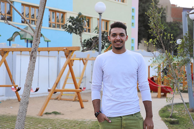 Mohamed Khamis, a volunteer for the Ending Violence against Women programme, poses for a picture in Imbaba. 
